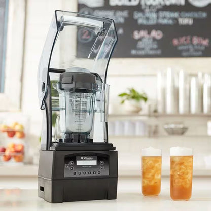 Blender on a counter with two glasses of iced tea in a kitchen setting