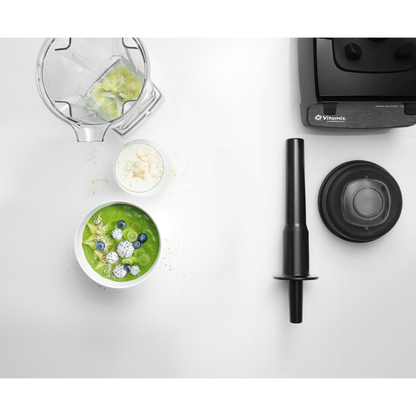 Vitamix Drink Machine Two-Speed 1.4L | Blenders Direct with a green smoothie and ingredients on a white surface